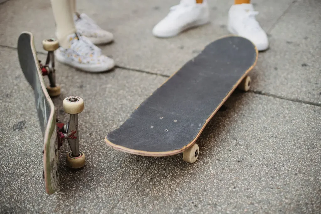 Skaters' feet and skateboards on a city square, seen from above