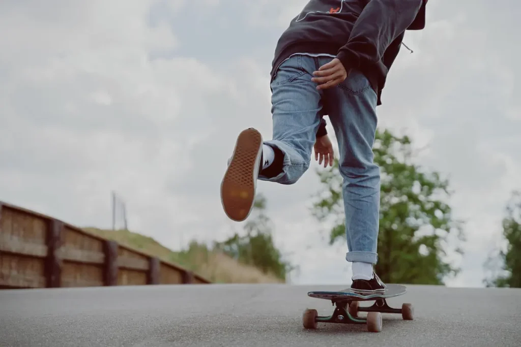 A rider on a longboard on a smooth road