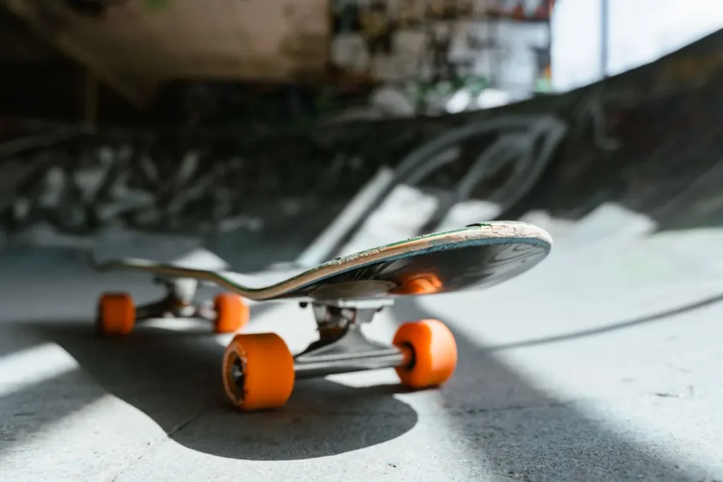 A low-angle view of a skateboard at a skatepark