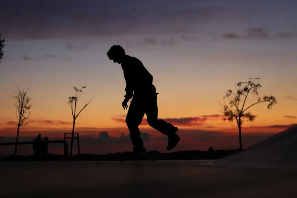 Silhouette of a skateboarder against a sunset in Istanbul